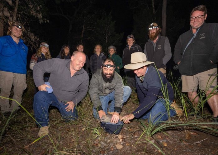 The Northern Bettong team surrounding Josh McAllister, AWC Sanctuary Manager, as he prepares to release one of Mount Zero-Taravale’s newest residents.