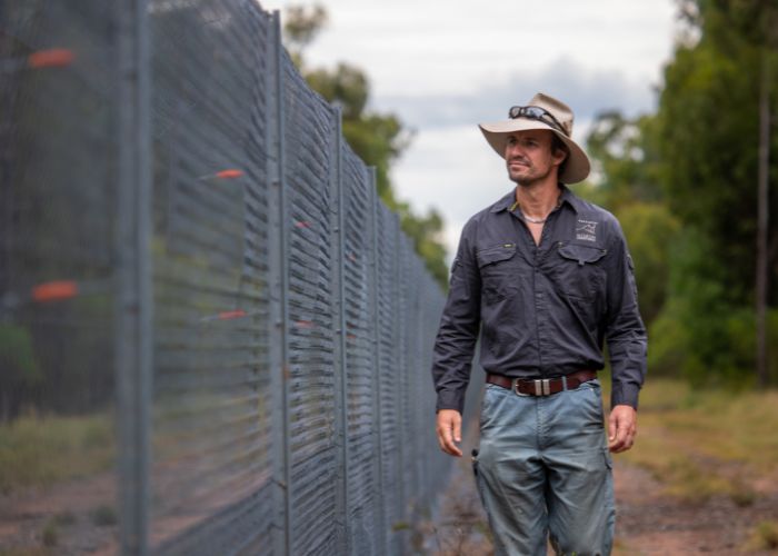 Wayne Sparrow, AWC Regional Operations Manager, inspects the Pilliga State Conservation Area fence line. 